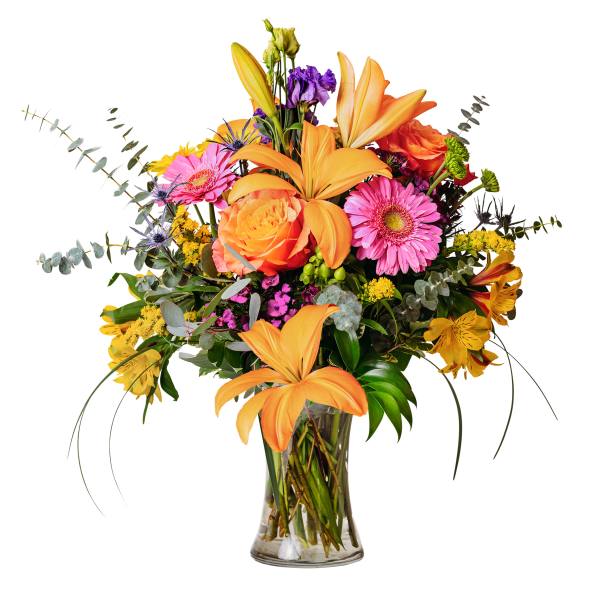 Mixed bouquet of orange lilies, pink gerbera daisies, and roses in a glass vase