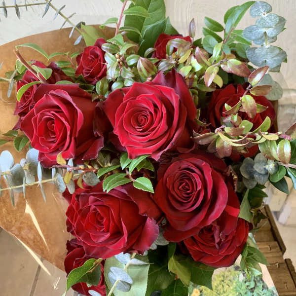Bouquet of red roses with eucalyptus and greenery