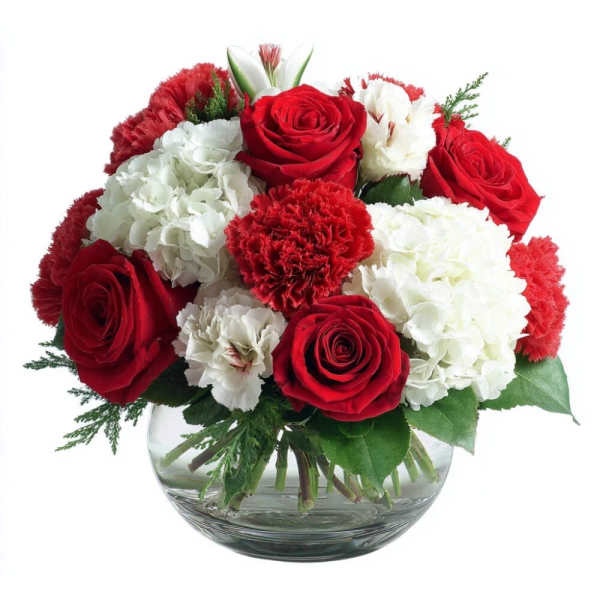 Red roses and white carnations arranged in a clear glass bowl vase