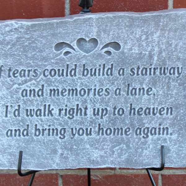 Stone memorial plaque with an engraved sympathy verse