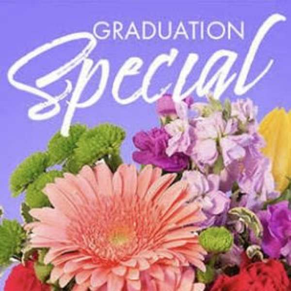 Colorful bouquet with a large pink gerbera daisy and mixed blooms on a purple graduation card