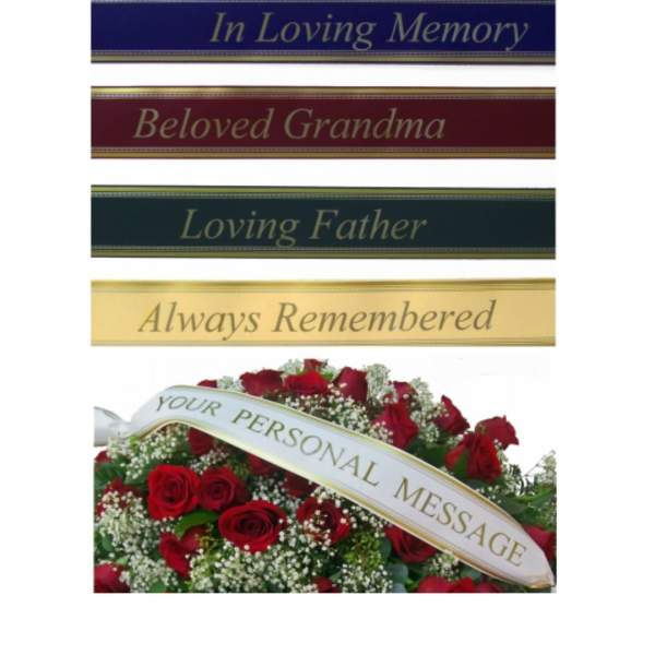 Red rose funeral arrangement with memorial ribbon