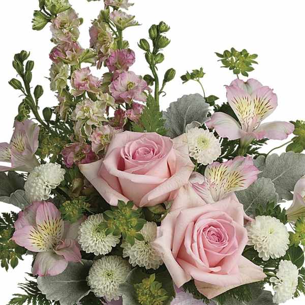 Bouquet of pink roses, white blooms, and pale alstroemeria