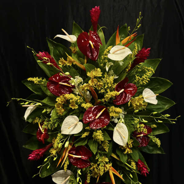 Large tropical floral spray with red and white anthuriums and yellow accents