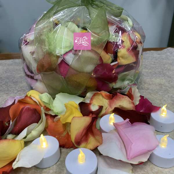 Wrapped bundle of multicolored rose petals with small LED tealights