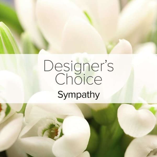 White tulips with a sympathy label