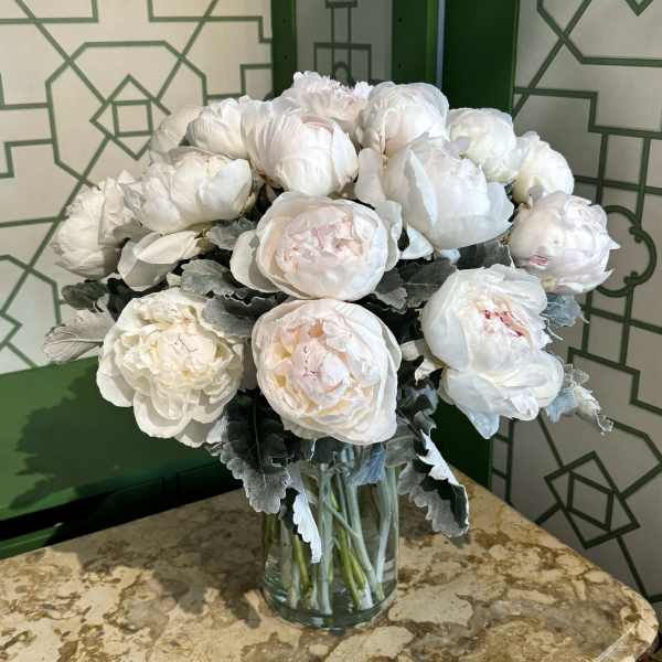 White peony bouquet in a clear glass vase