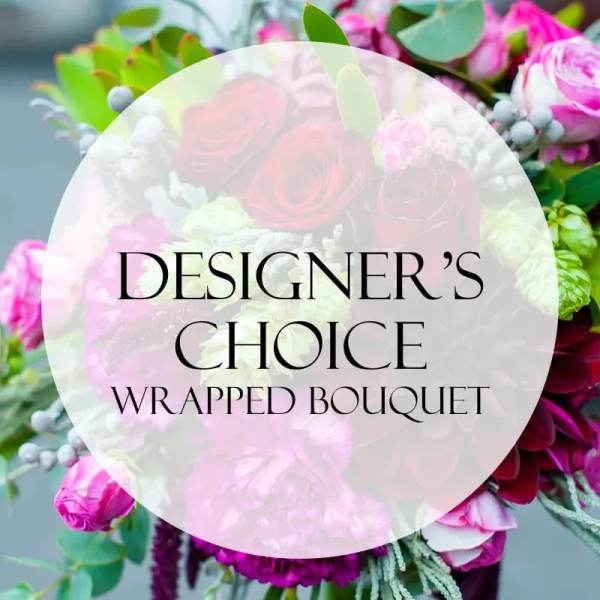 Wrapped bouquet of pink and white flowers with greenery