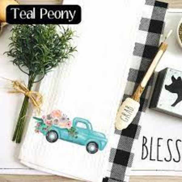 Bundle of greenery tied with twine beside a tea towel and brush