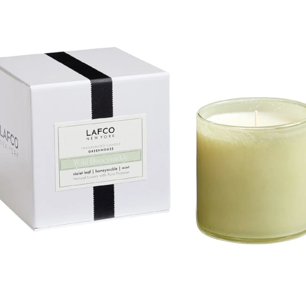 Boxed candle with a pale green glass jar