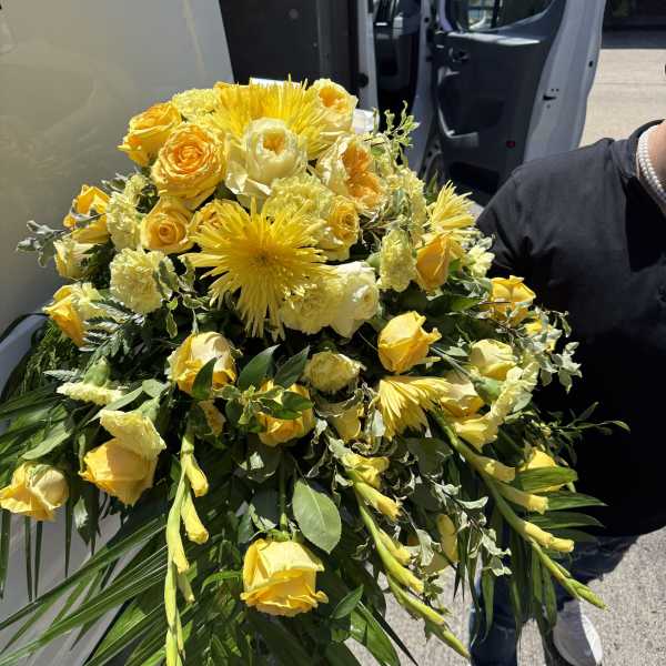 Yellow Yolk Sunrise Casket Spray