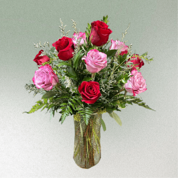 Bouquet of red and pink roses in a glass vase