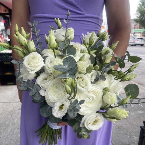 White bouquet of roses and lisianthus with eucalyptus