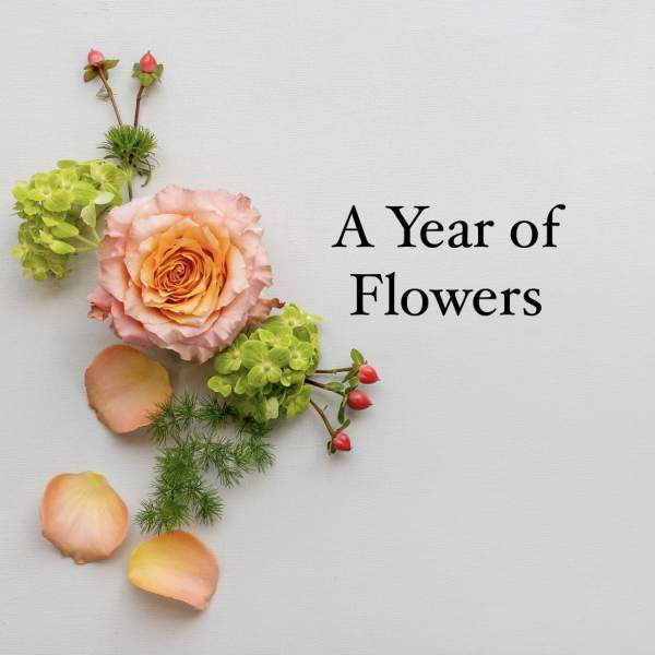 Peach rose with green blooms and petals arranged beside the words A Year of Flowers on a light background