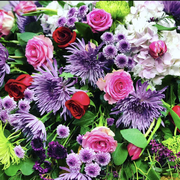 Mixed bouquet of pink, red, and purple flowers