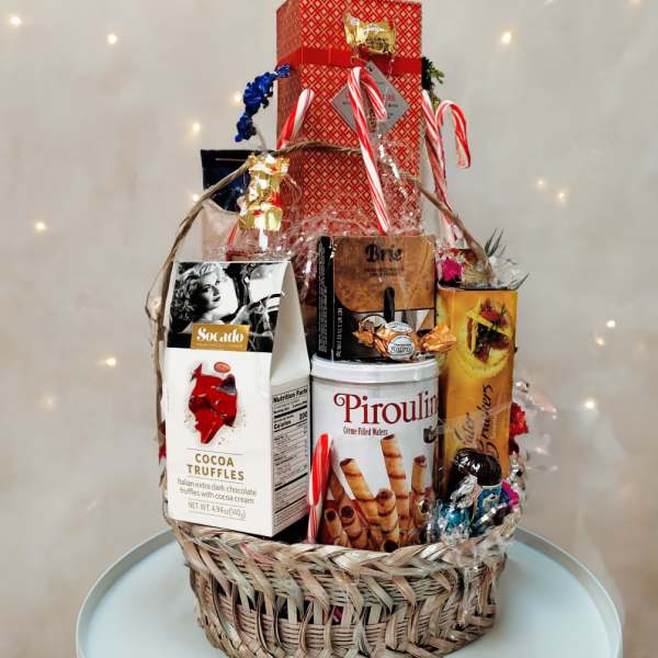 Basket of assorted chocolates and candy with candy canes