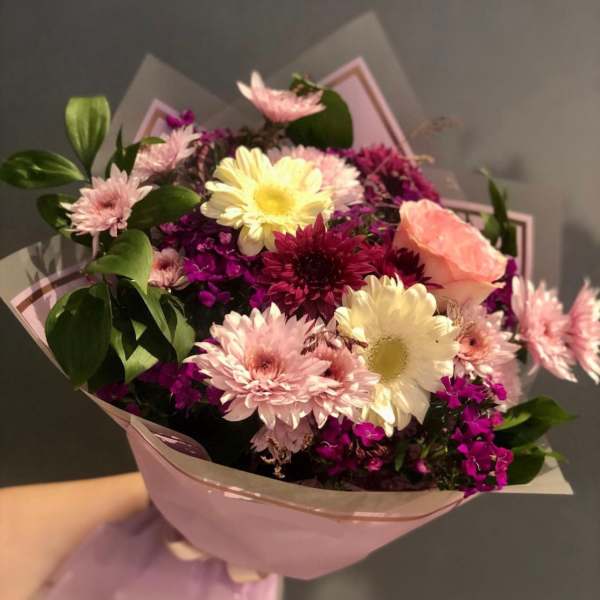 Pink and white mixed bouquet wrapped in pastel paper