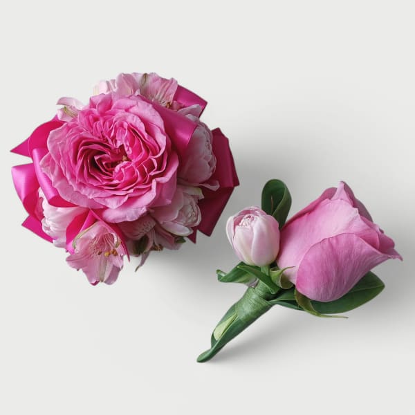Pink rose and mixed flower bouquet with matching pink rose boutonniere on white background