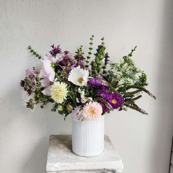 Mixed pastel bouquet in a white ribbed vase