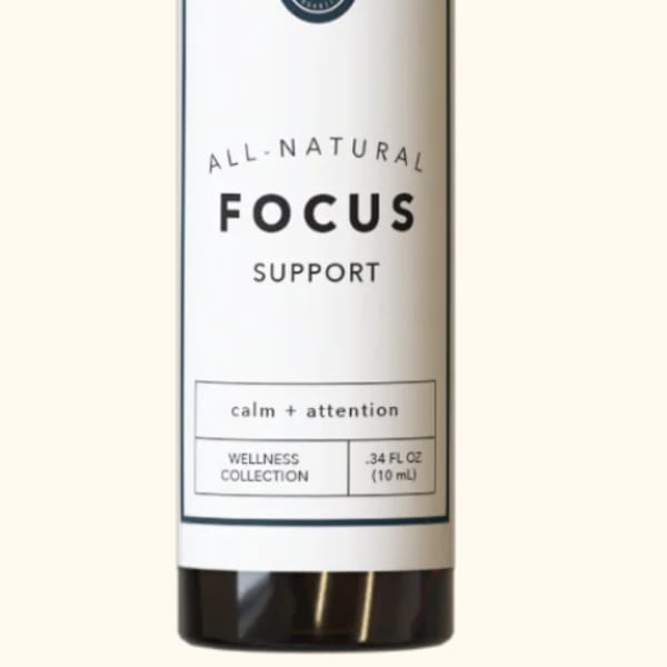 Small amber bottle with black cap labeled Focus Support