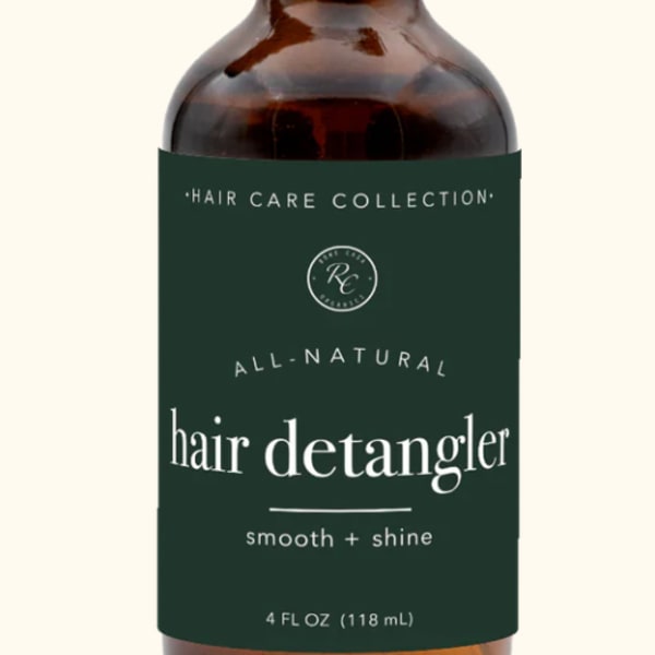 Amber spray bottle labeled hair detangler