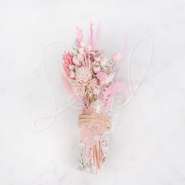 Pink dried flower bouquet wrapped with twine