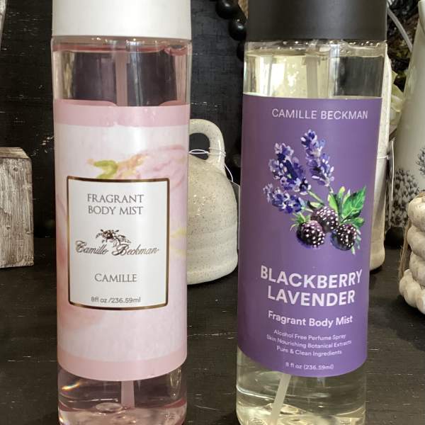 Two body mist bottles with white and black caps