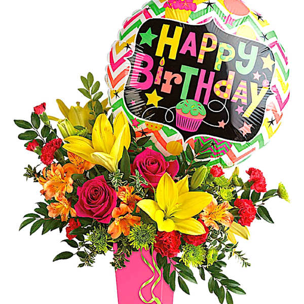 Birthday bouquet with roses, lilies, and a balloon in a pink vase
