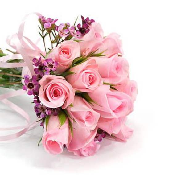 Pink rose bouquet with purple accent flowers and ribbon