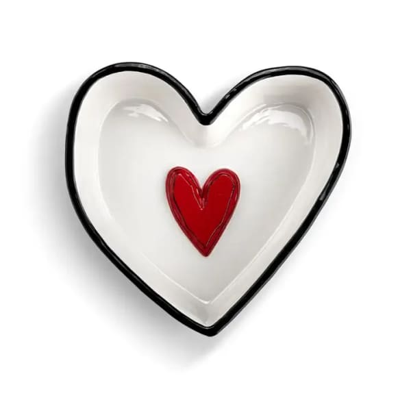 Heart-shaped white dish with a red heart in the center