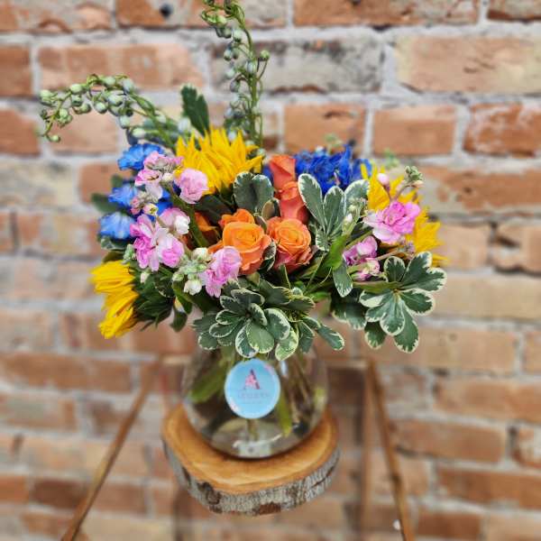 Colorful bouquet of mixed flowers in a glass vase