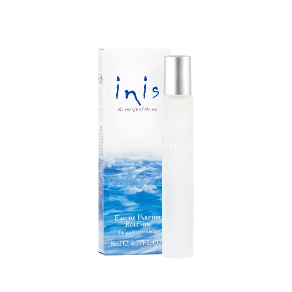 Roll-on perfume bottle beside its box with blue ocean-themed packaging