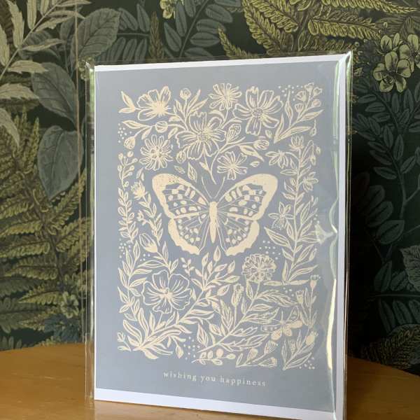 Greeting card with a butterfly and floral illustration