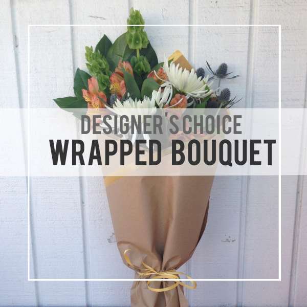 Wrapped bouquet with white daisies and orange alstroemeria