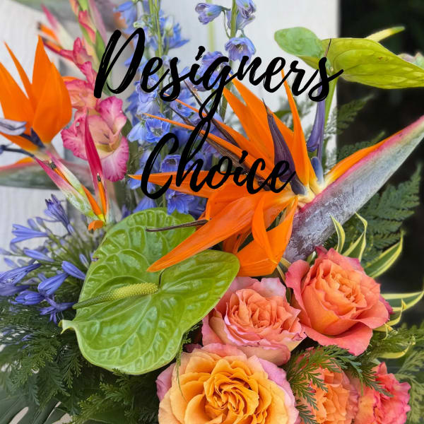 Tropical bouquet with orange birds of paradise and peach roses