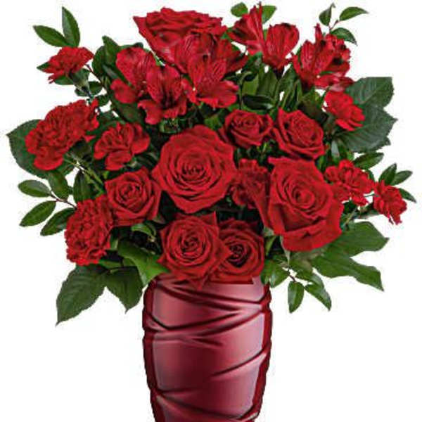 Red roses and alstroemeria in a red glass vase