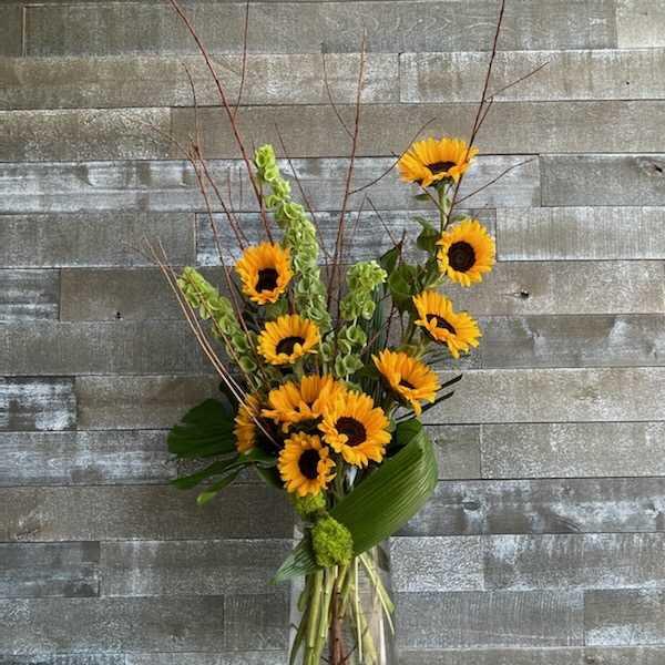 Sunflower arrangement in a clear glass vase