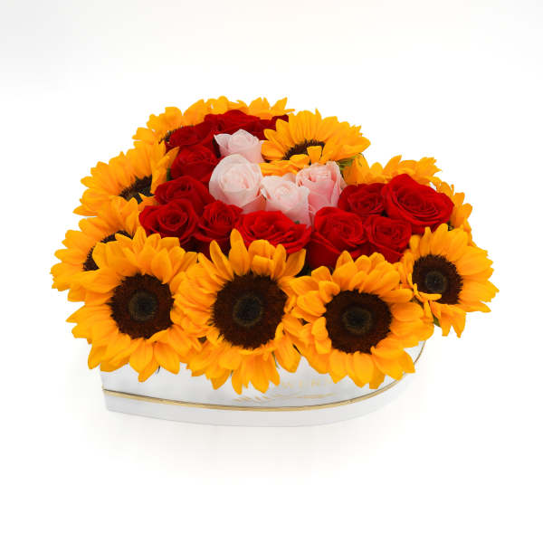 Heart-shaped box of red and pink roses with sunflowers
