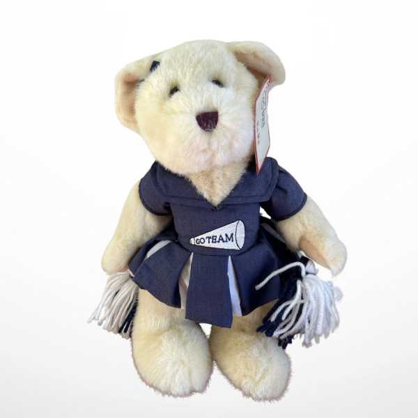 Plush teddy bear in a navy cheerleader outfit