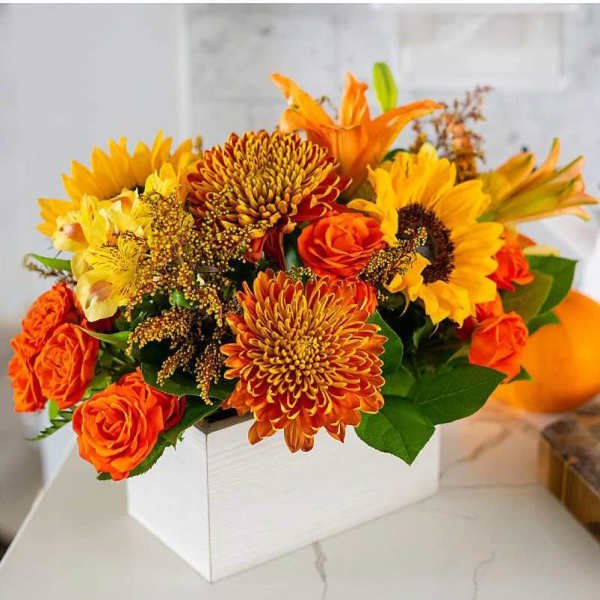 Orange and yellow bouquet in a white box