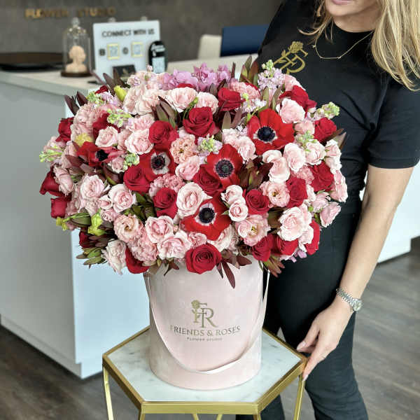 Large pink and red rose bouquet in a blush hatbox
