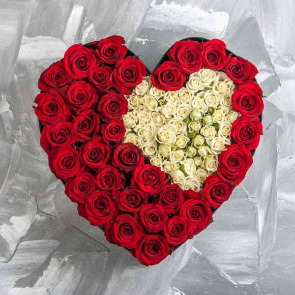 Heart-shaped box of red and white roses