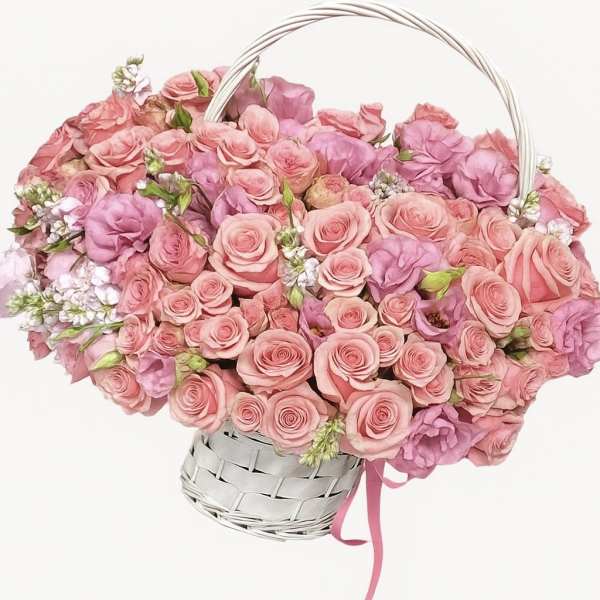 Basket of pink roses and purple blooms with a white handle