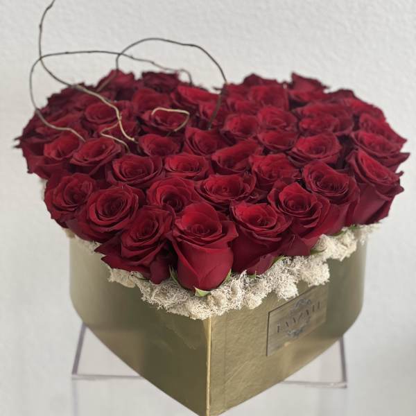 Heart-shaped box filled with red roses