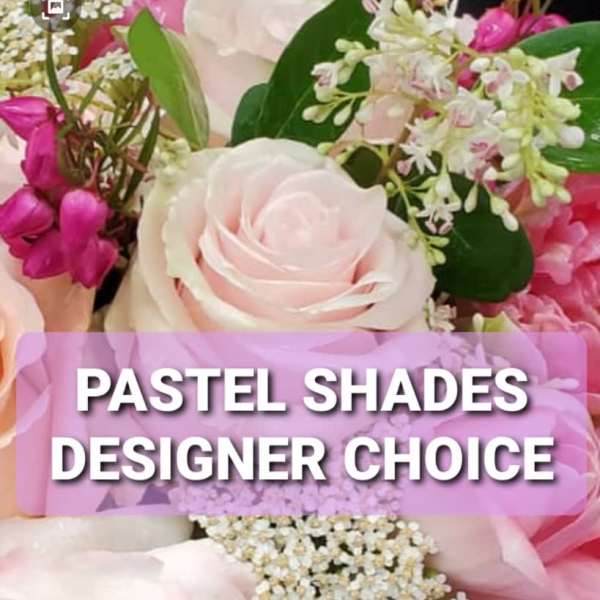Pastel pink and white roses with small filler flowers