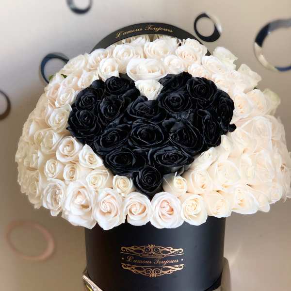 Black and ivory boxed rose arrangement with black heart-shaped rose cluster on top