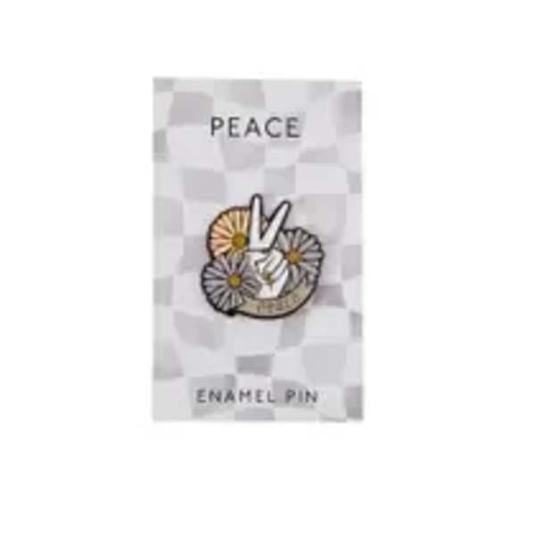 Enamel pin with a peace sign and flowers on a backing card