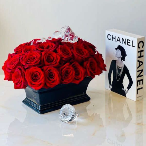 Red rose arrangement in a black box with clear crystal accents