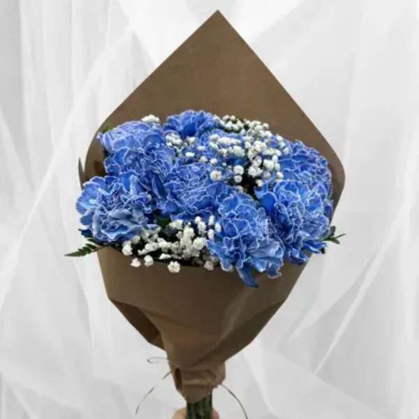 Blue carnation bouquet wrapped in brown paper