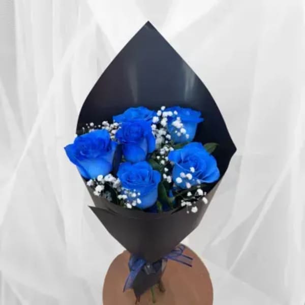 Bouquet of blue roses with white baby's breath in black wrap